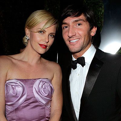 2010 Oscar After-Parties - Charlize Theron and Evan Lysacek - Vanity Fair Party