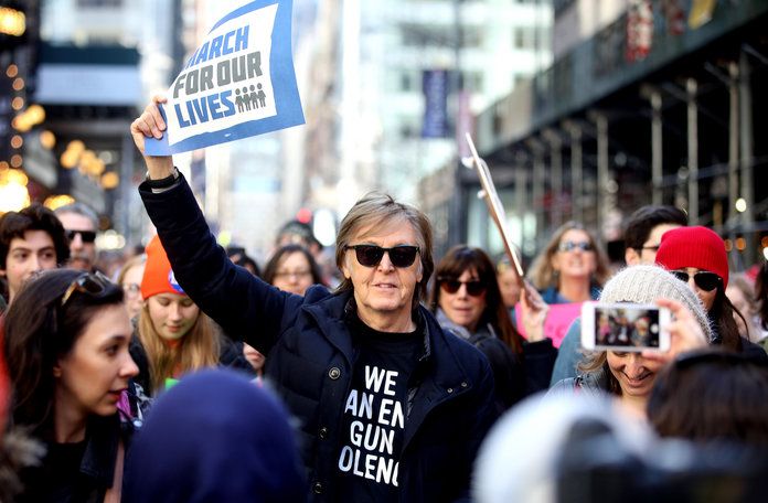 Paul McCartney marches in solidarity with the crowd. 