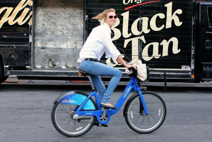 Supermodel Karlie Kloss rides a Citibike to the gym on July 2, 2014 in New York City