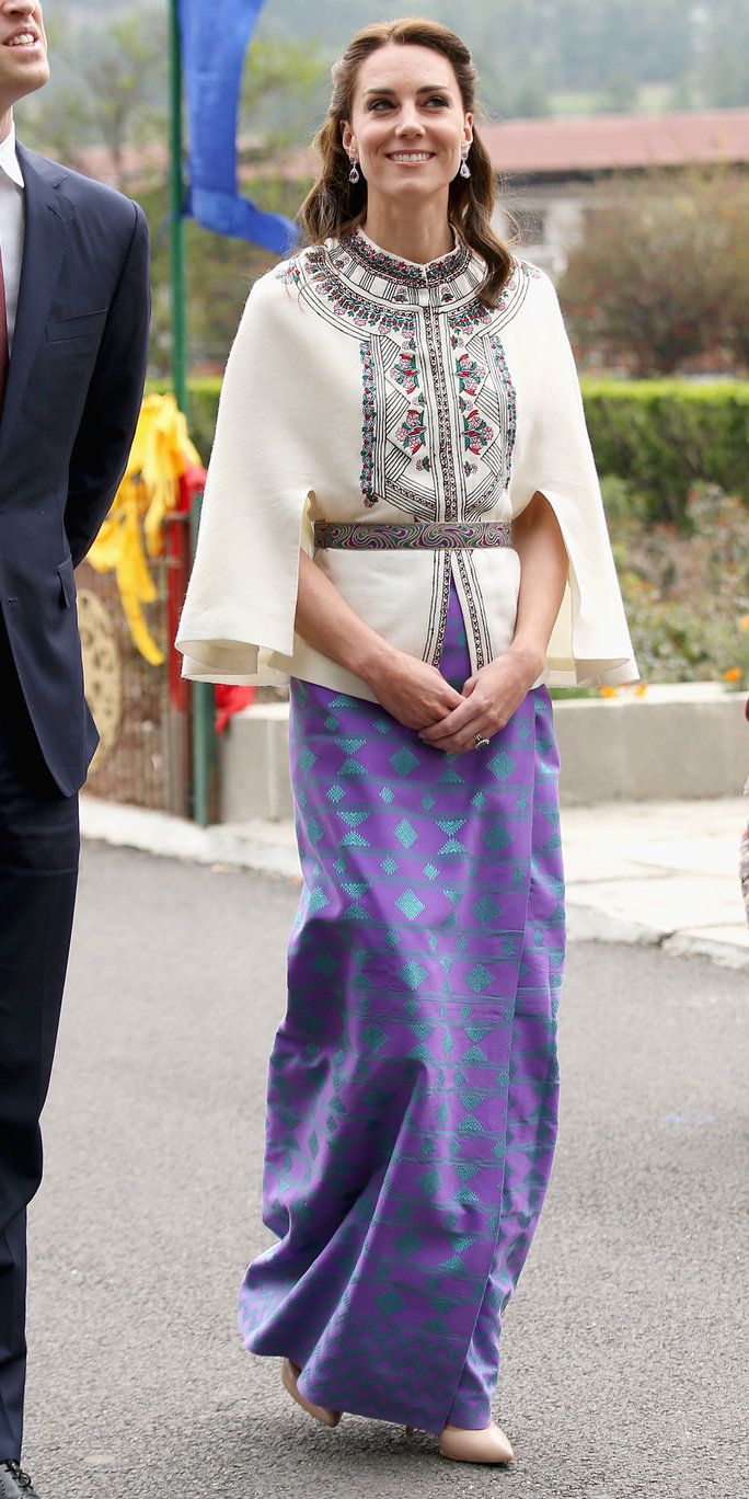 Катрин, Duchess of Cambridge walks with Prince William, Duke of Cambridge as part of a ceremonial Chipdrel on arrival into the Tashichhodzong (fortress) on the first day of a two day visit to Bhutan on the 14th April 2016 in Paro, Bhutan. The Royal cou