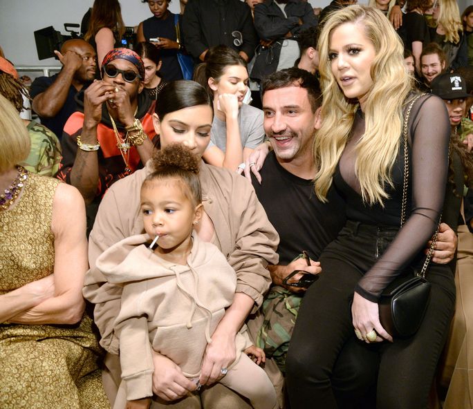 Ким Kardashian, North West, Ricardo Tisci, and Khloe Kardashian at Yeezy 2 front row