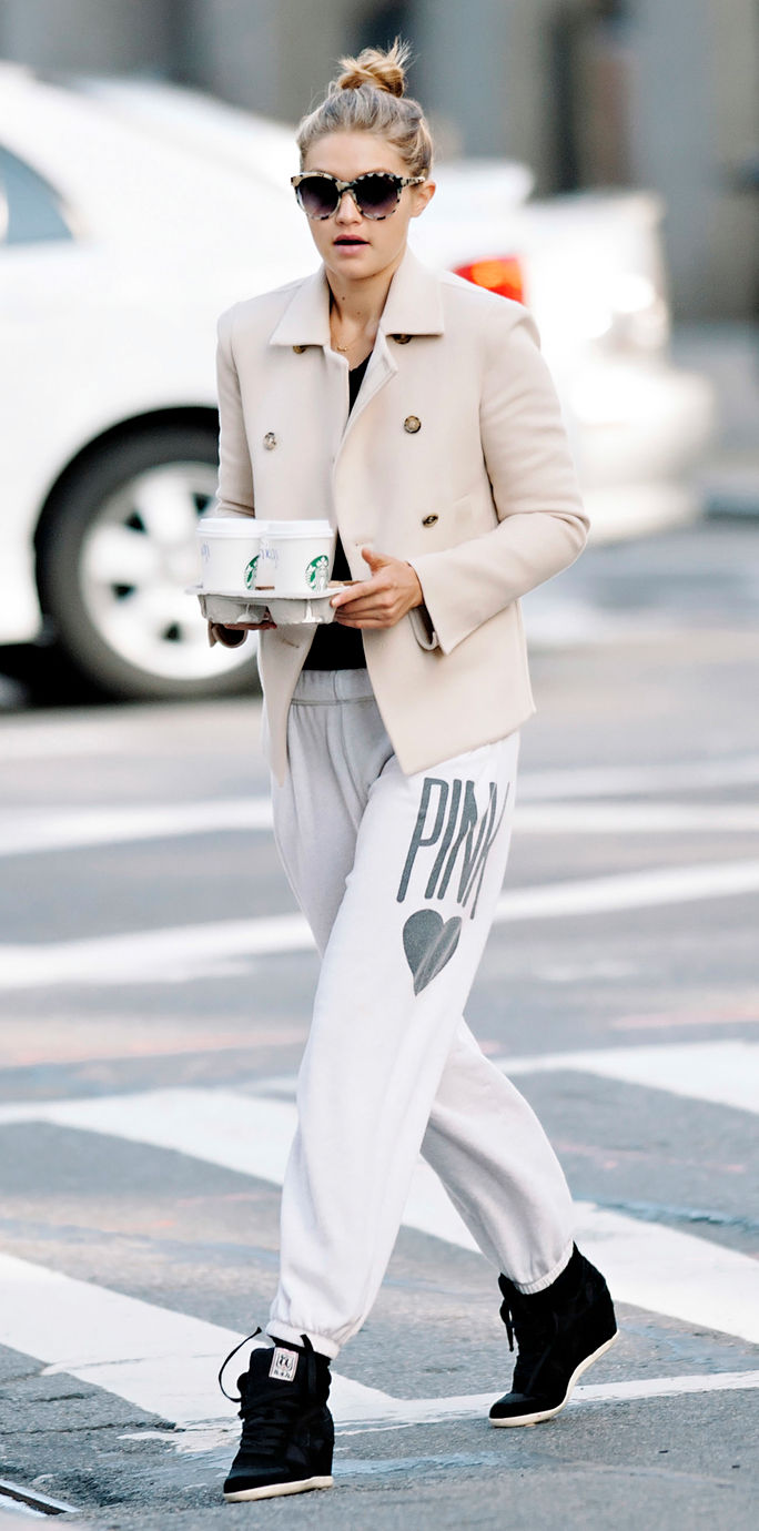 Gigi Hadid seen wearing white blazer and sweatpants while making a coffee run in NYC
